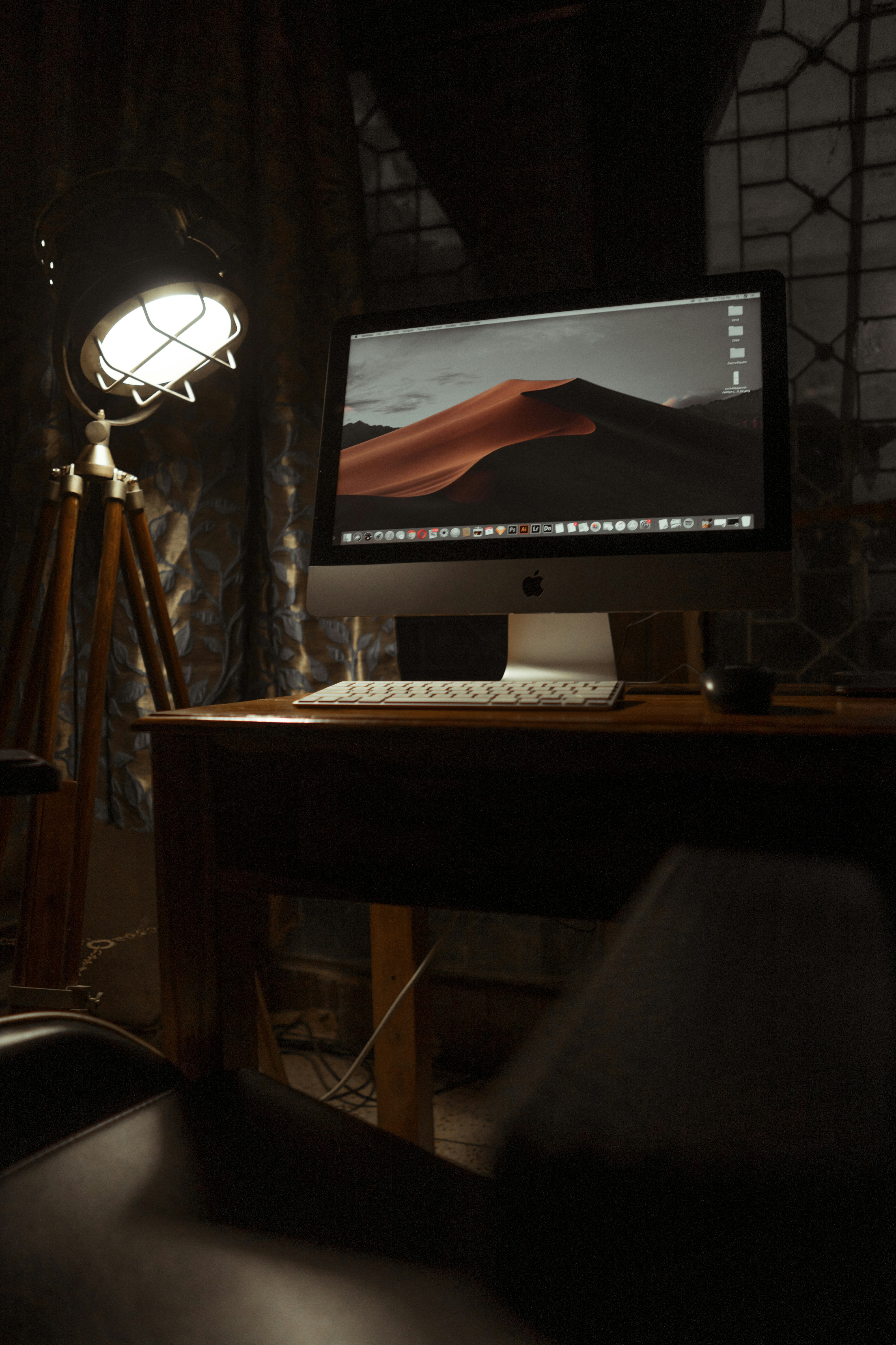 silver imac on brown wooden desk